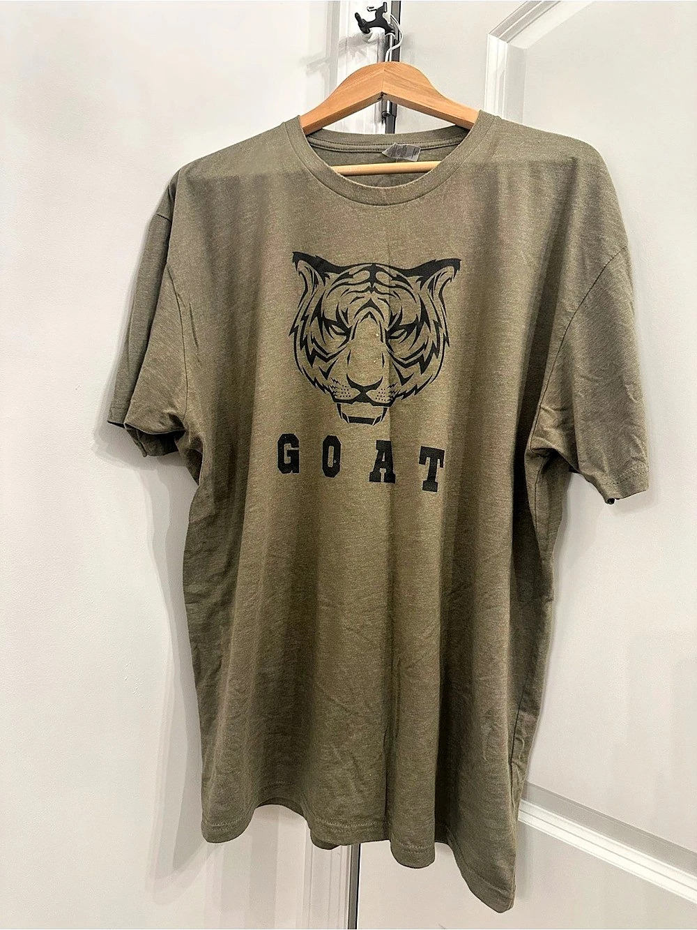 Swing Juice “GOAT” tiger graphic
tee Tiger Graphic Short Sleeve Tee in Green